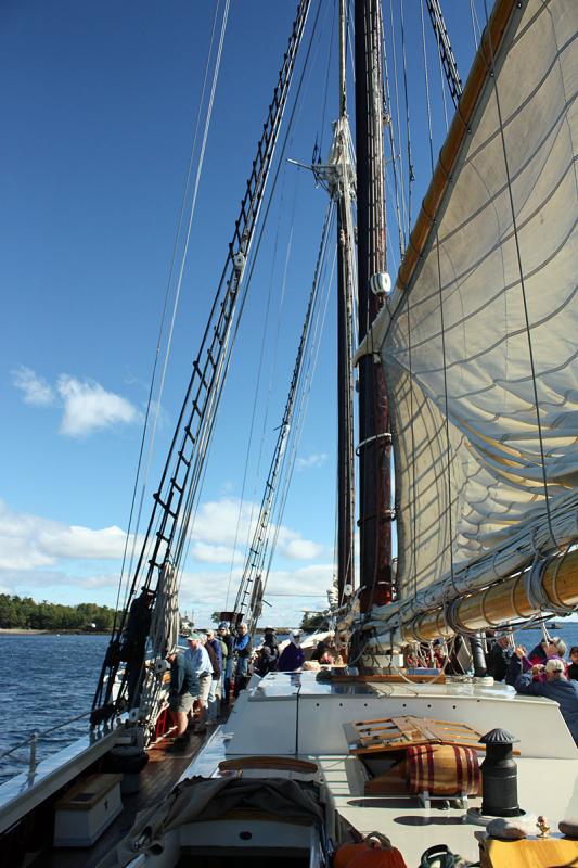 The sails going up in Camden’s outer harbor Sept. 26. (Photo by Holly S. Edwards)