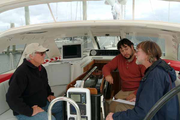 Cabot Lyman, Nigel Calder and Toby Teele discuss Kiwi Spirit's systems. (Photo by Shlomit Auciello)