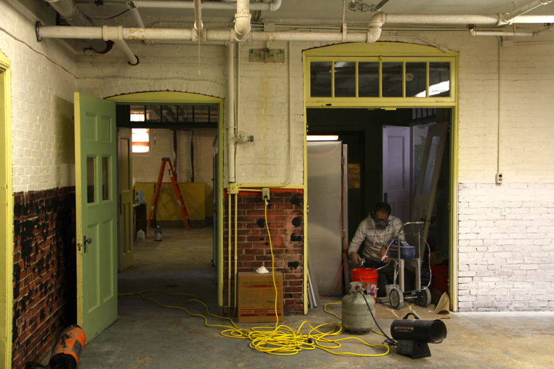 Working to renovate and prepare the old building for winter. (Photo by Wes Sterrs)