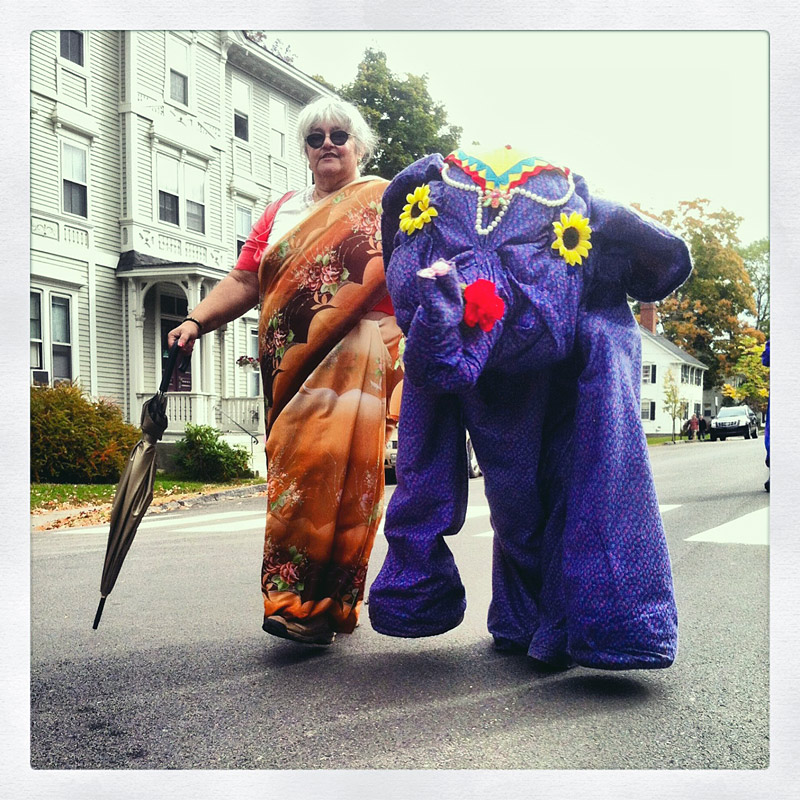 An indigo elephant and companion march down Church Street. (Photo by Ethan Andrews)