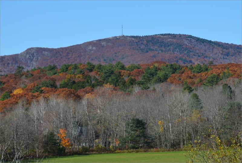 Ragged Mountain, with its cellular tower, lies along the Rockport-Camden town line. (file photo by Lynda Clancy)