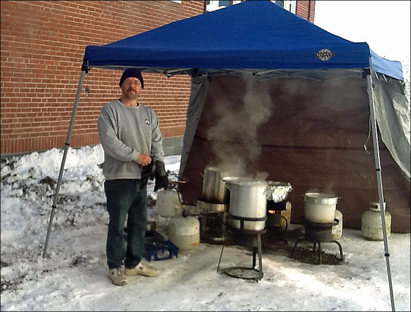 Mark Corson mans the cookers at last year’s Thanksgiving Day Dinner at Thompson Community Center in Union. (Courtesy Bill Packard)