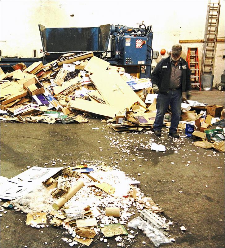 Granville Ames deals with a pile of improperly sorted foam packing peanuts at the transfer station in Rockport. (Courtesy MCSWC)