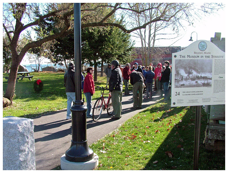 City officials placed a wreath, left, in Heritage Park to mark the moment for future generations. Along the route, Belfast historian Megan Pinette pointed out places of significance in Belfast’s past. (Photo by Ethan Andrews) City officials placed a wreath, left, in Heritage Park to mark the moment for future generations. Along the route, Belfast historian Megan Pinette pointed out places of significance in Belfast’s past. (Photo by Ethan Andrews)