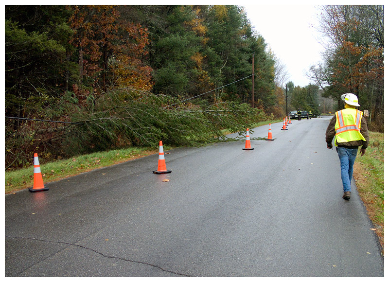 Firefighters in the town of Waldo wait for a CMP crew to clear a tree that fell across a power line on Kendall Corner Road Friday morning. (Photo by Ethan Andrews)