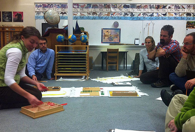Jade Door (primary) co-teacher Darci Grotton shows parents how Montessori methods can help children understand fractions. (Courtesy Children's House Montessori School)