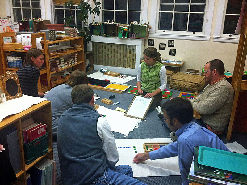 Jade Door co-teacher Darci Grotton leads a lesson for parents in division using Montessori teaching materials. (Courtesy Children's House Montessori School)