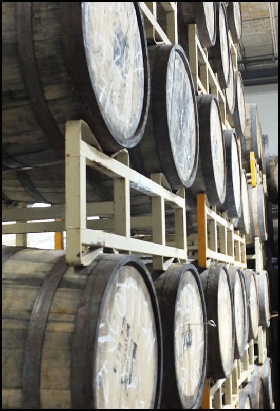 Barrels used for aging certain beers wait out their time at Shipyard Brewing. (Photo by Chris Wolf)