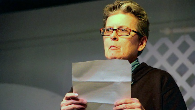 Laurence Coe of Rockland reads one of her poems at the Playhouse Theater in Belfast, Nov. 22. A small turnout at the bi-monthly poetry slam led to the creation of an all new event. (Photo by Wes Sterrs)