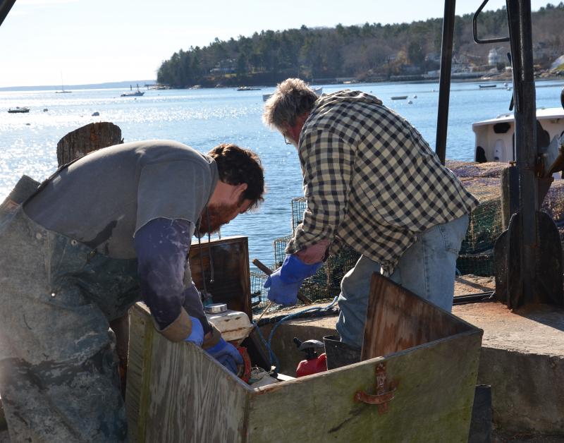 The crate hoist operates by a gasoline generator. Sometimes it quits. (Photo by Lynda Clancy) lobster boats Rockport Harbor Maine