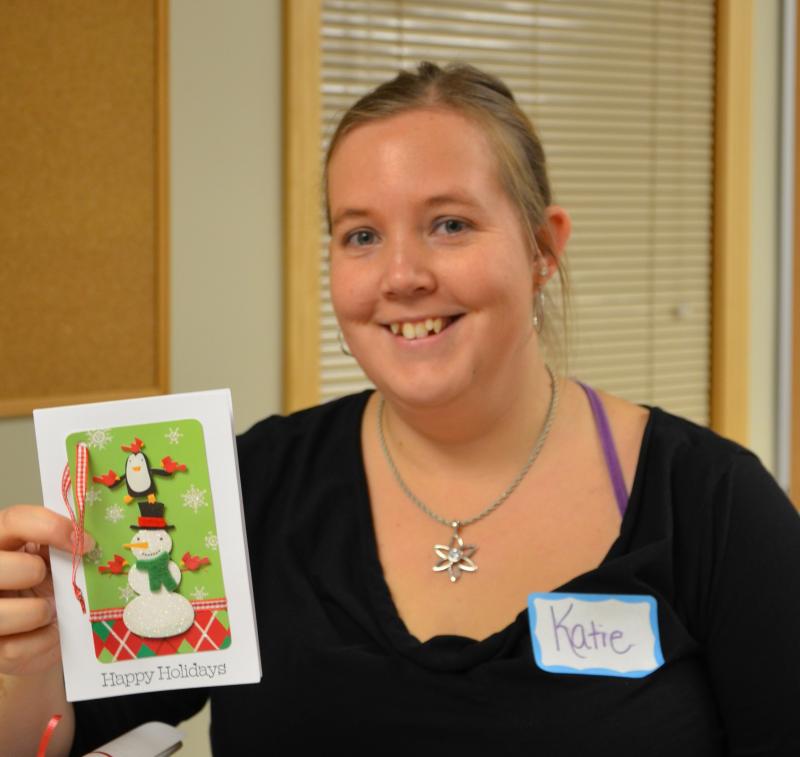 Katie Dakin, a dispatcher with Waldo County Communications, made Christmas cards for each of the callers this year. All the callers received cards and gifts made specially for them. (Photo by Lynda Clancy)