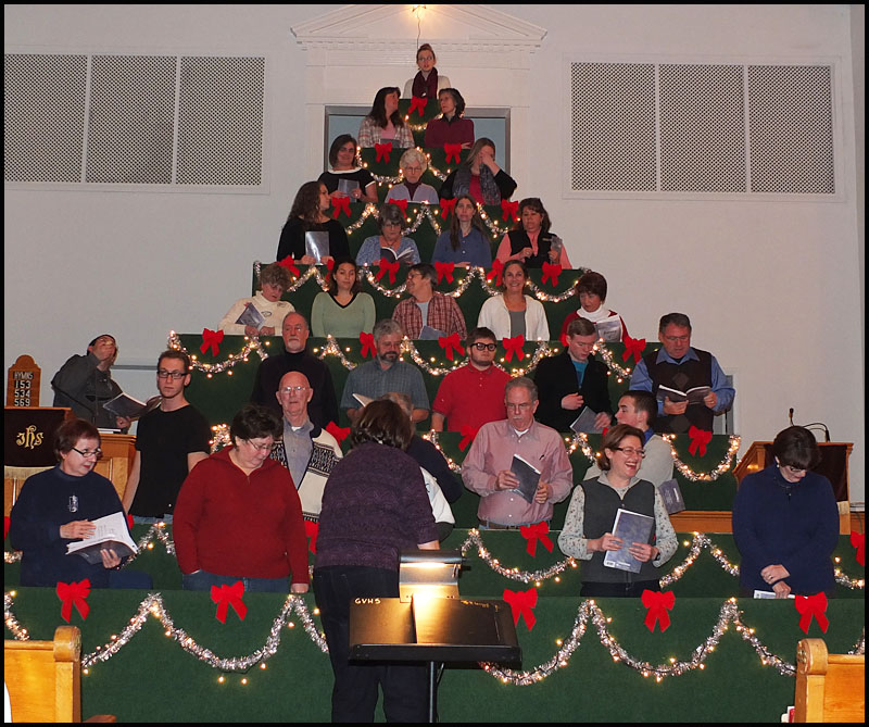 Choir members assemble on the tree.