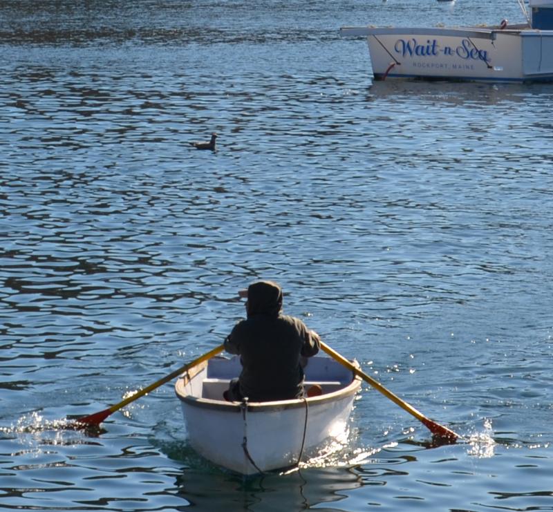 Tying up the boat and rowing in. (Photo by Lynda Clancy) lobster boats Rockport Harbor Maine
