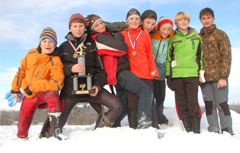 The Camden Snow Bowl boys team posing with their first place trophy from the Marlee Johnston Slalom Race at Kents Hill Jan. 4. From left, Caellen Roberts (sixth place), Aiden Roberts (first place), Ethan Andrus, Aiden Manahan (fifth place), Michael Frampton (thirrd place), Cedar Andrus, Max Moore and Tommy Thelander. (Courtesy Steve Frampton)