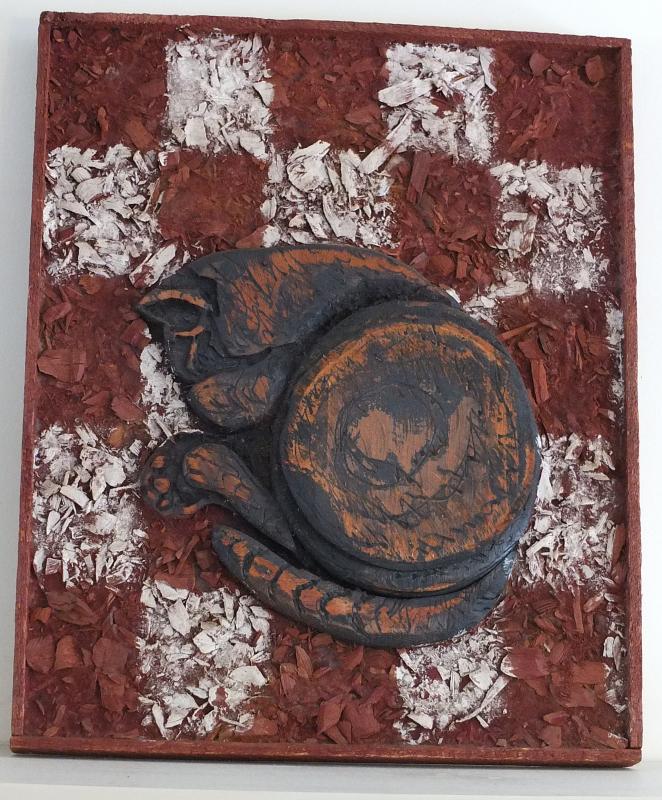 THIS RELIEF of a cat curled up on a chessboard is 17 by 21 inches and can be seen at Wiscasset Public Library. SUZI THAYER/Boothbay Register