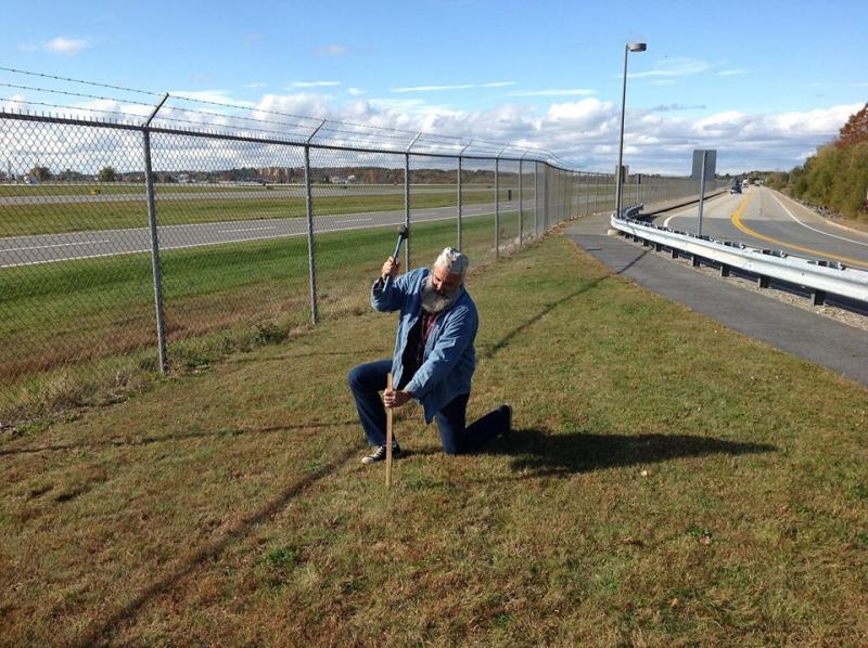 Sawyer marking the place where the sculpture will be installed at the Portland Jetport. (Photo courtesy Jay Sawyer)