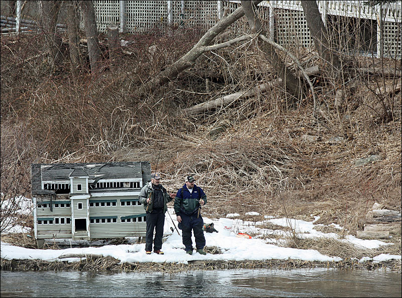 Two anglers on the shore of the mill pond above the waterfalls at the Knox Mill in Camden March 19. (Photo by Holly S. Edwards)