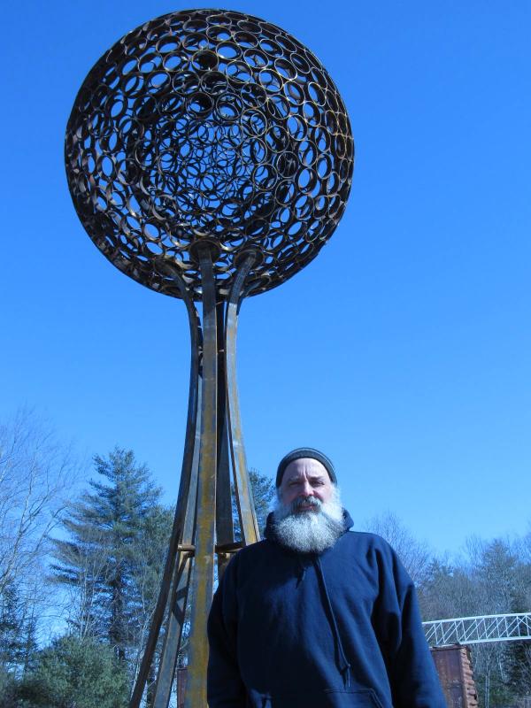 Sawyer posing by his sculpture. (Photo by Kay Stephens)