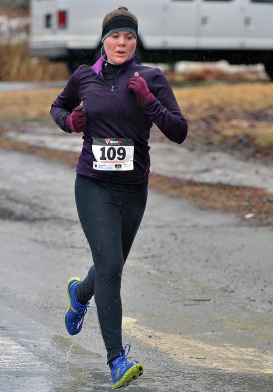 Caitlin Cross was the first female and third overall to cross the finish line. (Photo by Ron Hawkes)