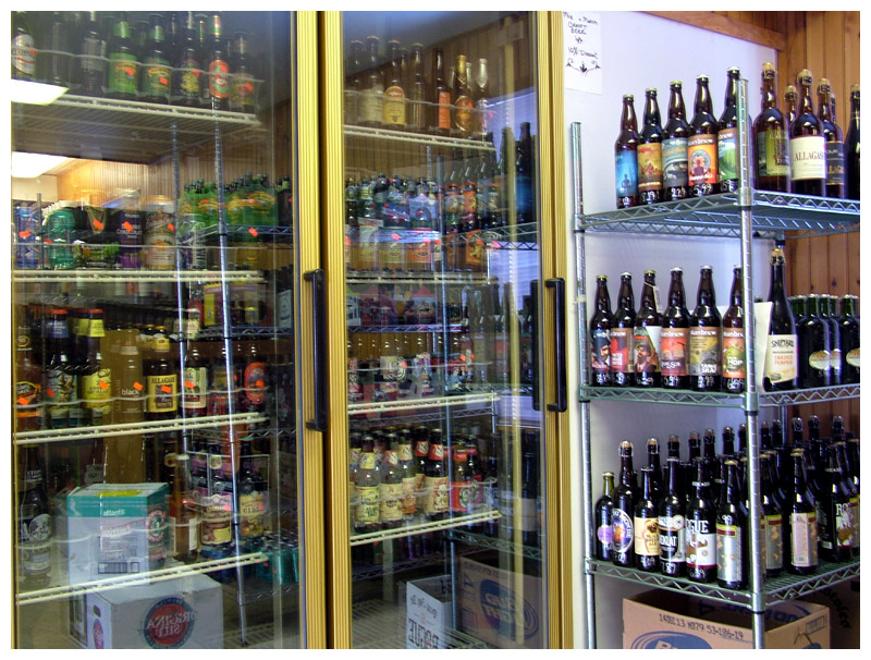 Monroe General Store manager Joan Hayward’s background in specialty beer and wine sales partly accounts for a selection that would have been unheard of in a small general store a decade ago. (Photo by Ethan Andrews)