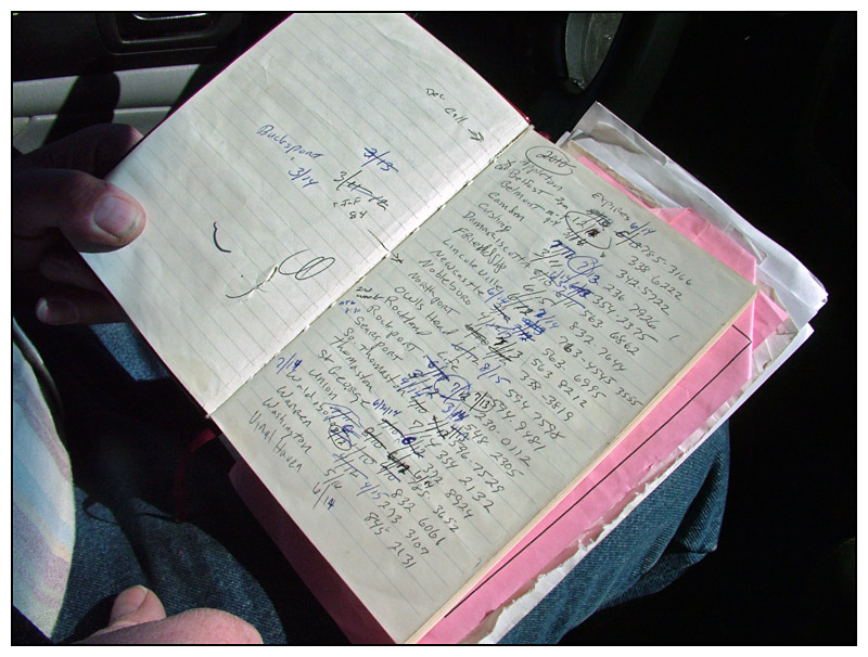 A handwritten log of the towns Wiggin covers, annotated with the date of his most recent visit. (Photo by Ethan Andrews)