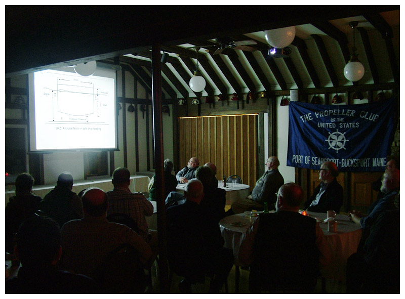 At the Shrine Club in Belfast, March 19, members of the Propeller Club watch a slide presentation on the logistics of cargo shipping at Searsport’s Mack Point. (Photo by Ethan Andrews)