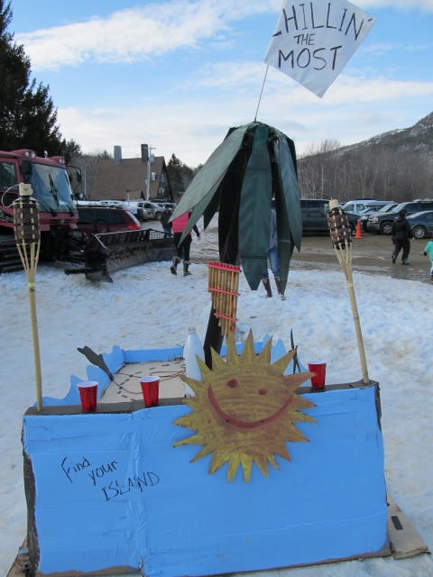 The first racer to go down the hill was an elaborate barge with coconuts and a palm tree. (Photo by Kay Stephens)