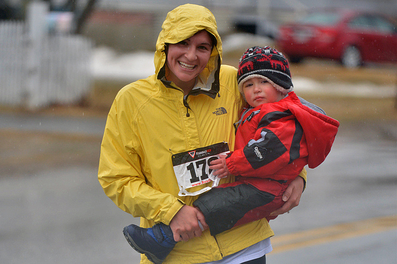 Lauren Frances and son battle the rain. (Photo by Ron Hawkes)
