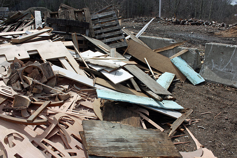 The transfer station’s demolition wood pile Tuesday morning contained sheets of Blueboard insulation, which the facility is asking people to be sure and not place in the pile. (Photo by Holly S. Edwards)