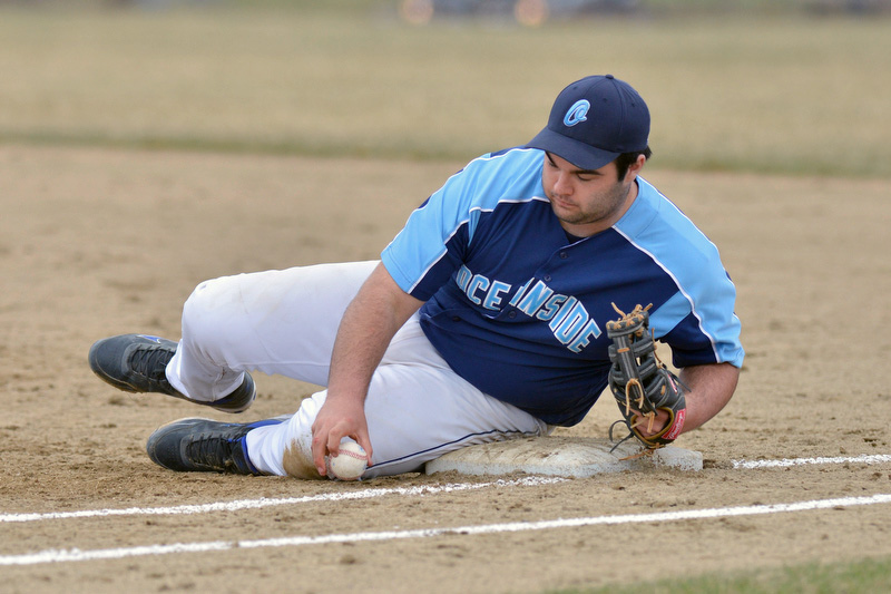 Oceanside’s Thomas Curtis uses whatever means necessary to keep the ball in the infield. (Photo by Ron Hawkes)