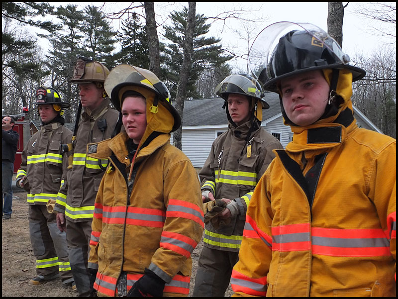 Rockport firefighters watch the last fire Sunday. (Photo by Chris Wolf)