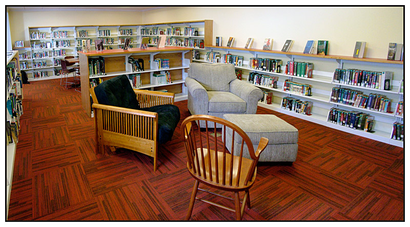 The library’s new teen space has comfortable furniture and several tables and chairs for studying. Soon it will have computers and a monitor for the occasional gaming event. (Photo by Ethan Andrews)