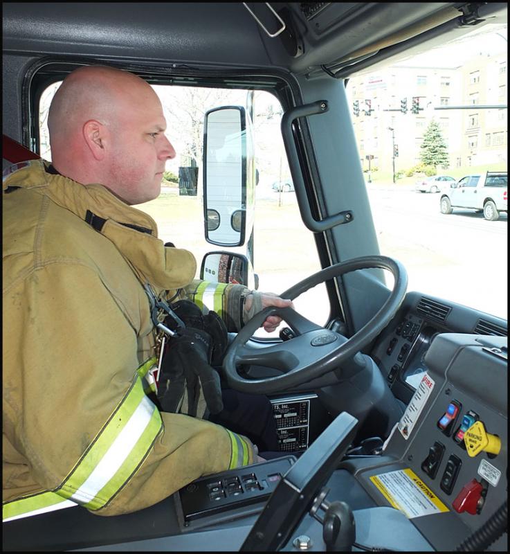 Patrick Lowe pulls the truck from the fire station