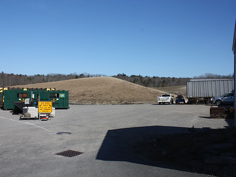 By the end of the day Saturday, April 12, Mid-Coast Solid Waste Corp. staff will have moved the transfer station’s recycling bins, left, and tucked them up against the building and big rig trailer on the right. If you don’t have to recycle next week, it would be better to put it off while drilling operations are underway next week, April 14-18. (Photo by Holly S. Edwards)