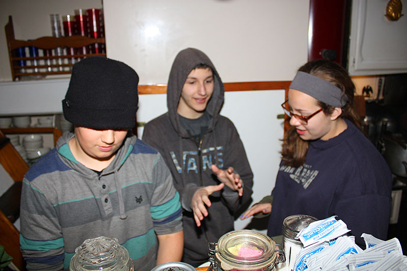 Wednesday morning before departure, and after breakfast, Appleton Village School students work in the galley washes dishes. (Photo by Holly S. Edwards)