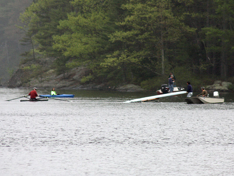 The missing rower’s sculling boat is righted on the lake Tuesday. (Photo by Holly S. Edwards)