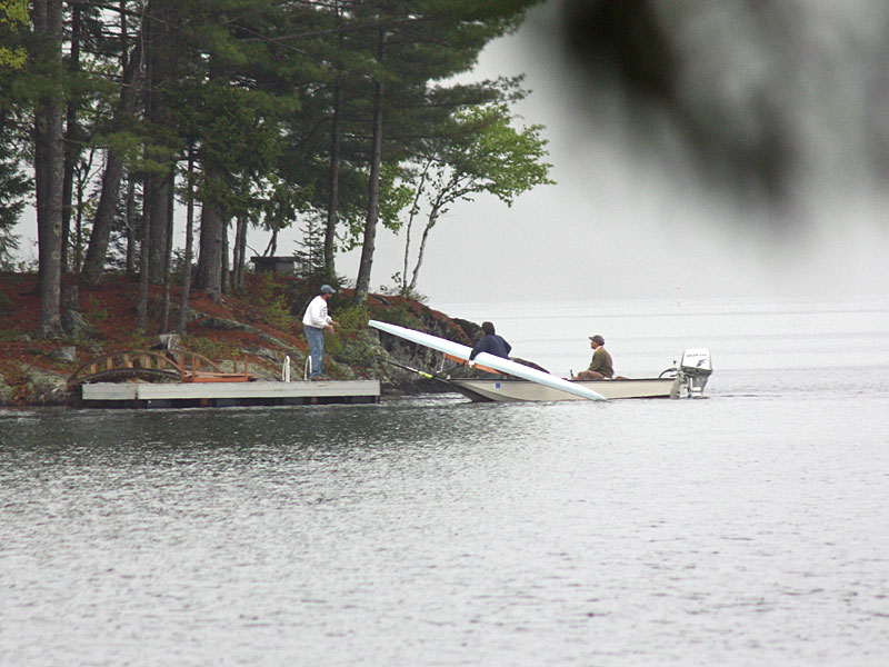 The missing rower’s scull boat is brought to shore. (Photo by Holly S. Edwards)
