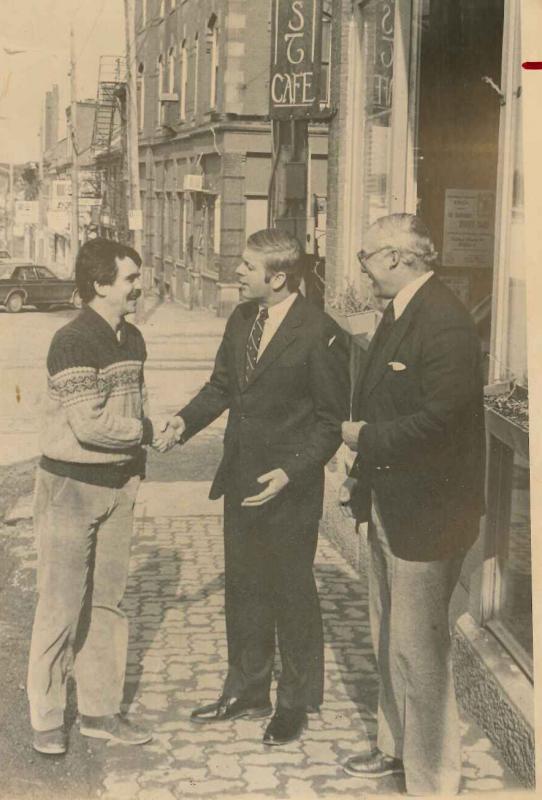 Mike Hurley greeting Gov. Joe Brennan and Mayor Monroe B. Hall post-1979 and pre-1984 in front of Hurley’s Belfast Cafe. Note the old street light wood poles. (Photo courtesy Mike Hurley)