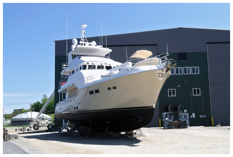 A 75-foot yacht awaits transport by the larger of two travel lifts at Front Street Shipyard on Friday. (Photo by Ethan Andrews)