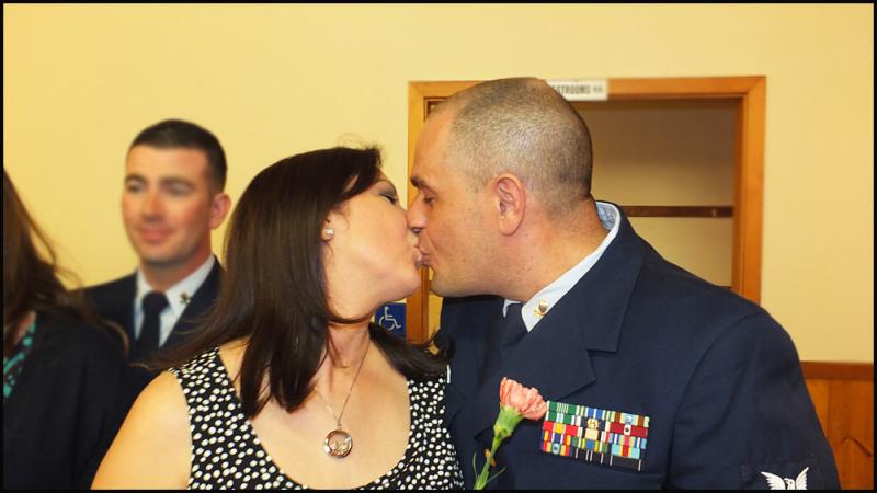 Brenda and Joaquin Guzman share a kiss during the spouse appreciation portion of the dinner.