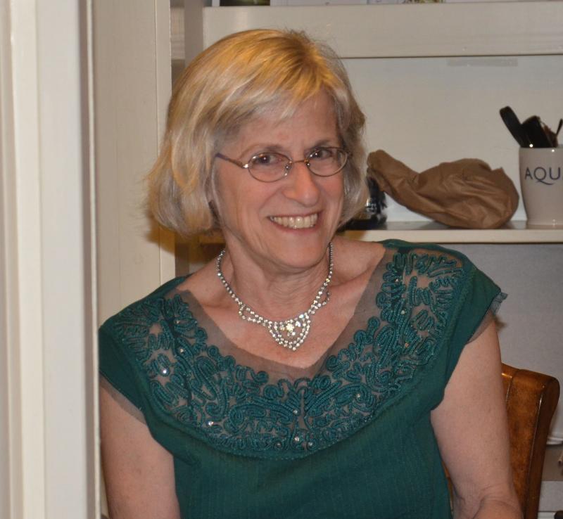 Wayfinder Schools consultant and long-time staffmember Andrea Itkin, of Camden, sells tickets to the show. (Photo by Lynda Clancy)