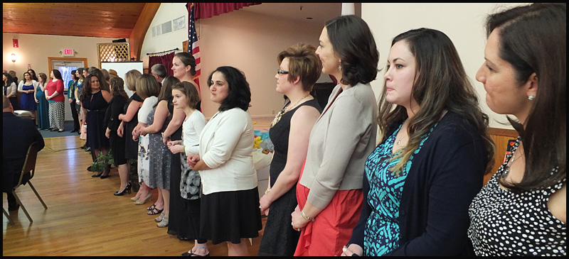 The Coast Guard spouses were honored with applause and flowers Friday night.