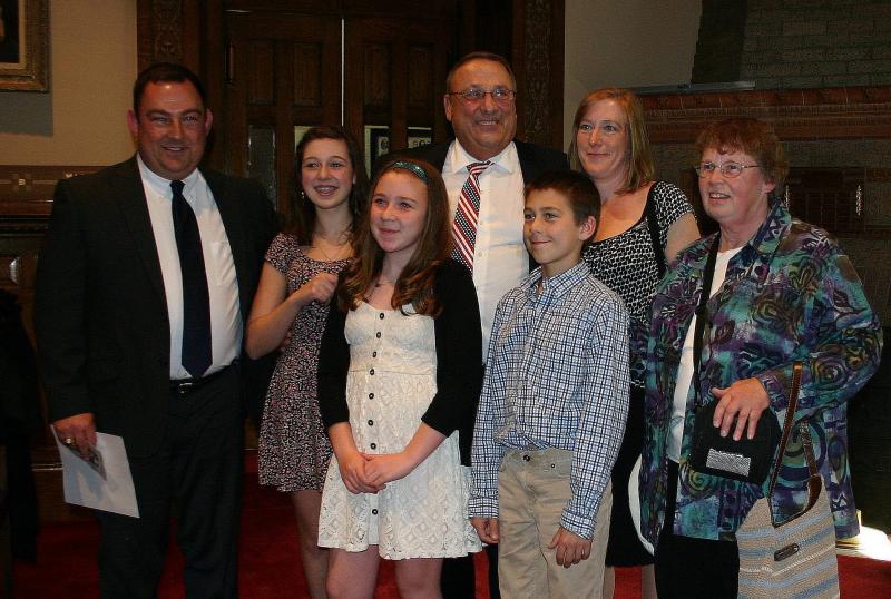 Eric Walker with (from left to right): daughters Alison,15, and Kristina, 13, Governor LePage, son Tommy, 11, wife Susan and Walker’s mother, Catherine Walker. (Photo by Erica Thoms)