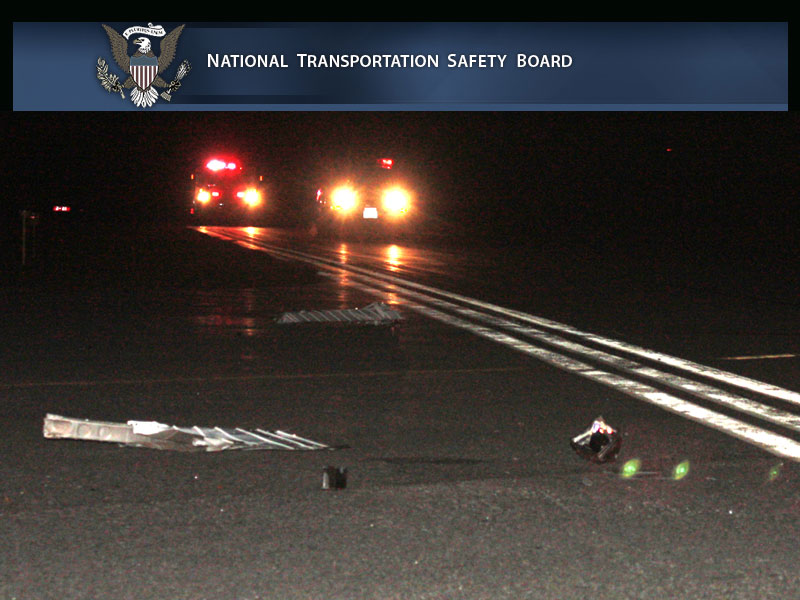 Debris and parts from the collision of 1994 GMC Sonoma pickup truck with the private Cessna airplane on runway on the night of Nov. 16, 2012. The pilot and two passengers were killed in the crash, after which the airplane caught fire. The truck’s driver was uninjured. (Photo by Holly S. Edwards)