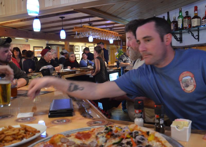 Brewmaster Ben Hazen tends to a full bar May 1 at Andy’s Brewery. (Photo by Lynda Clancy)