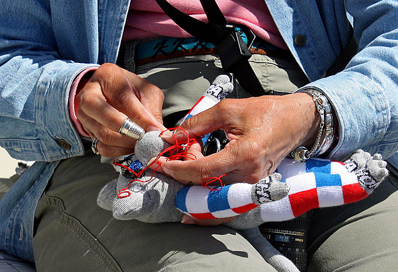 Sewing unique sock monkeys was one way passengers spent their idle hours on the Mary Day this week. (Photo by Holly S. Edwards)