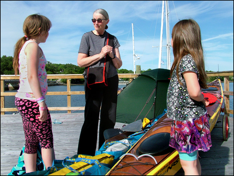 Deborah Walters, center, talks with Alice, left, and Eliot Andrews while organizing her gear for a kayak trip from Maine to Guatemala starting next month. (Photo by Ethan Andrews)
