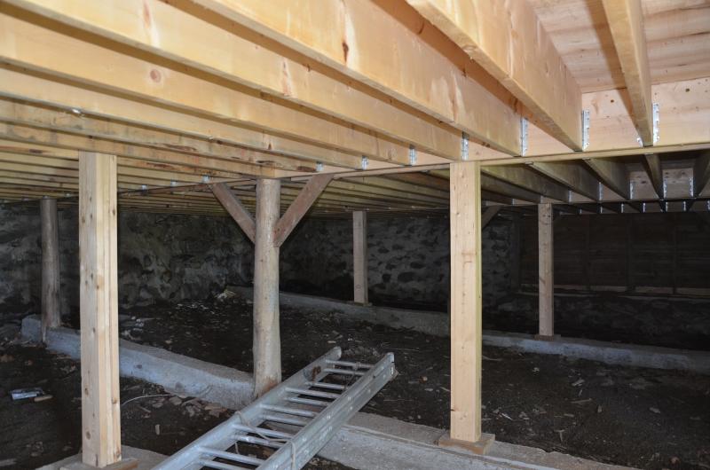 A new barn floor sits over the old basement. Strong enough for a vehicle to pull in overhead.