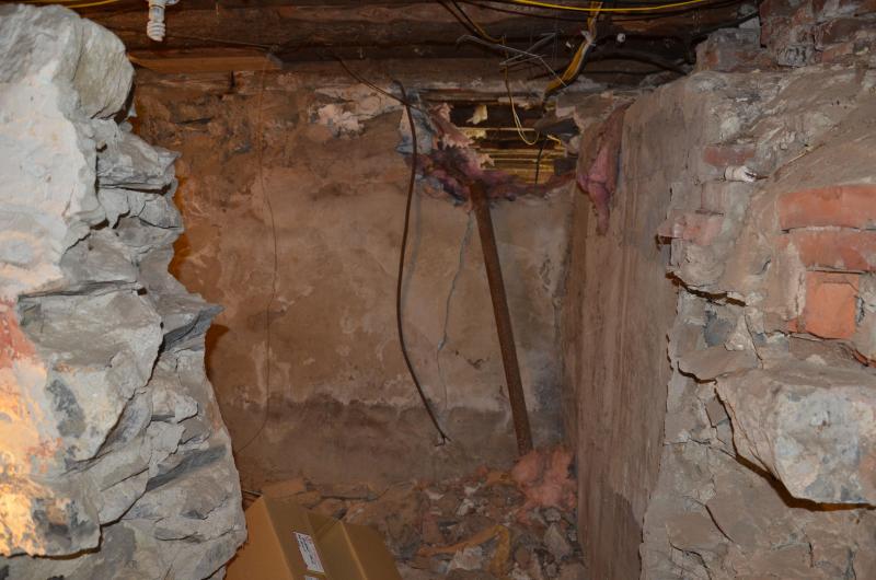 The old cistern is in the basement, where water for the household was stored.