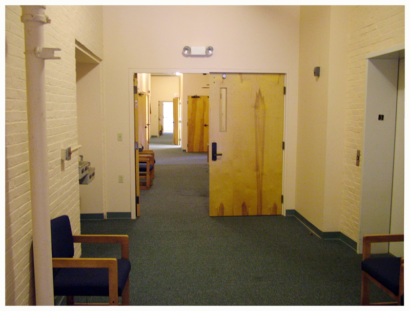 The third-floor hallway has a more residential feel than the lower floors, with rooms and suites on either side. (Photo by Ethan Andrews)